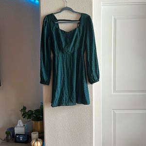 Long sleeve green cocktail dress with open back style
